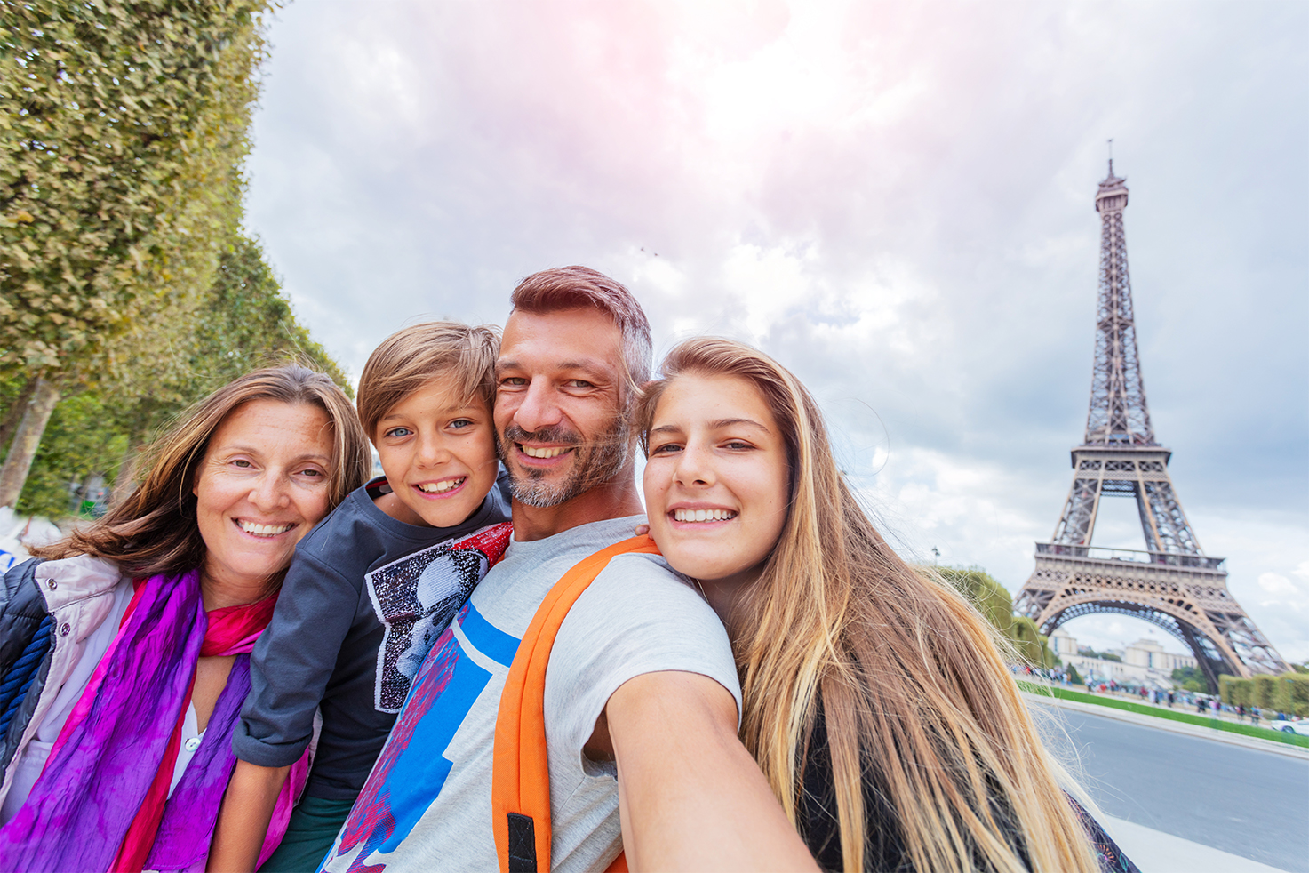 A family of four captures priceless Parisian memories that they paid for through their vacation savings account.