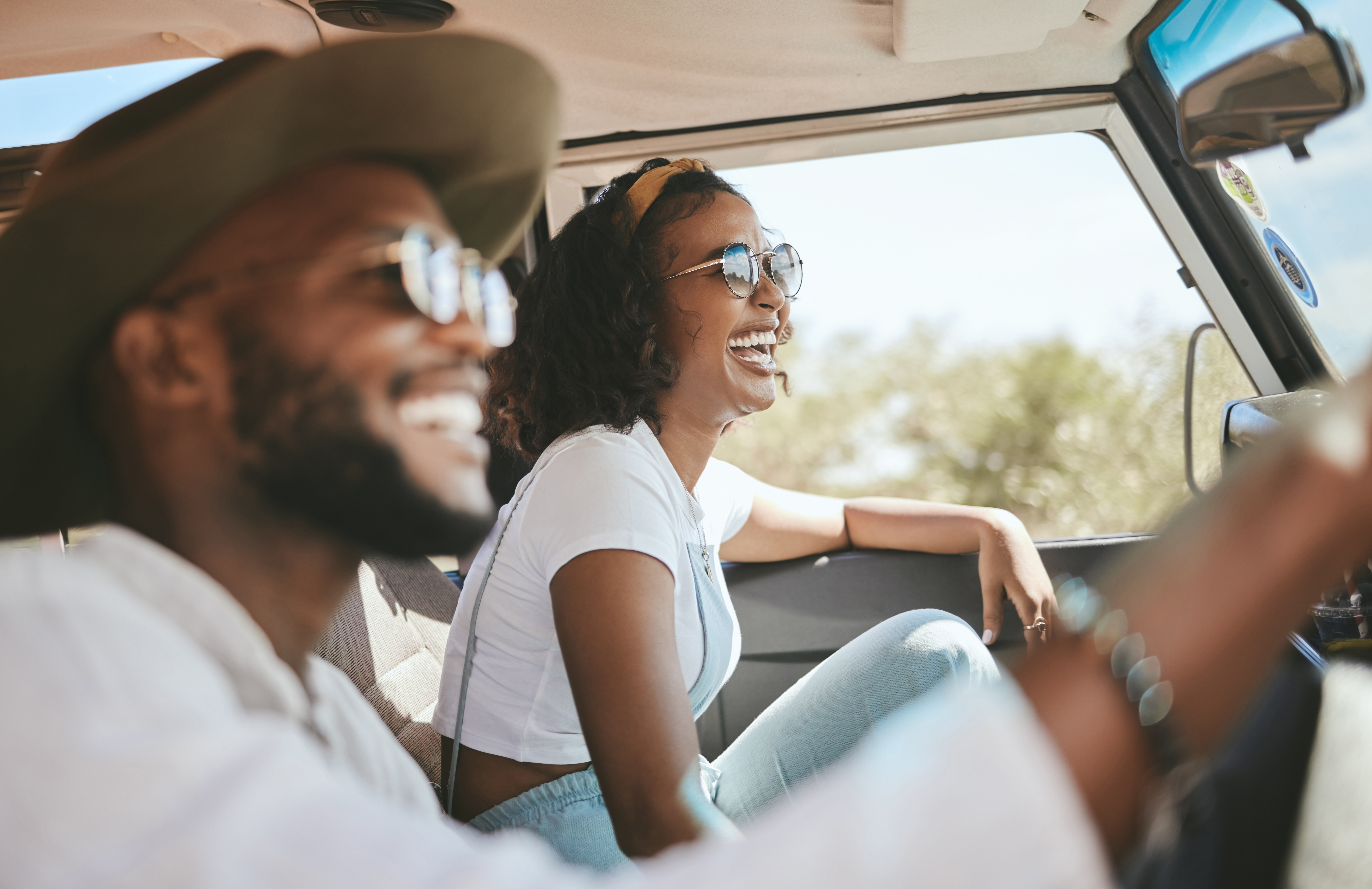 A couple enjoy driving their new vehicle