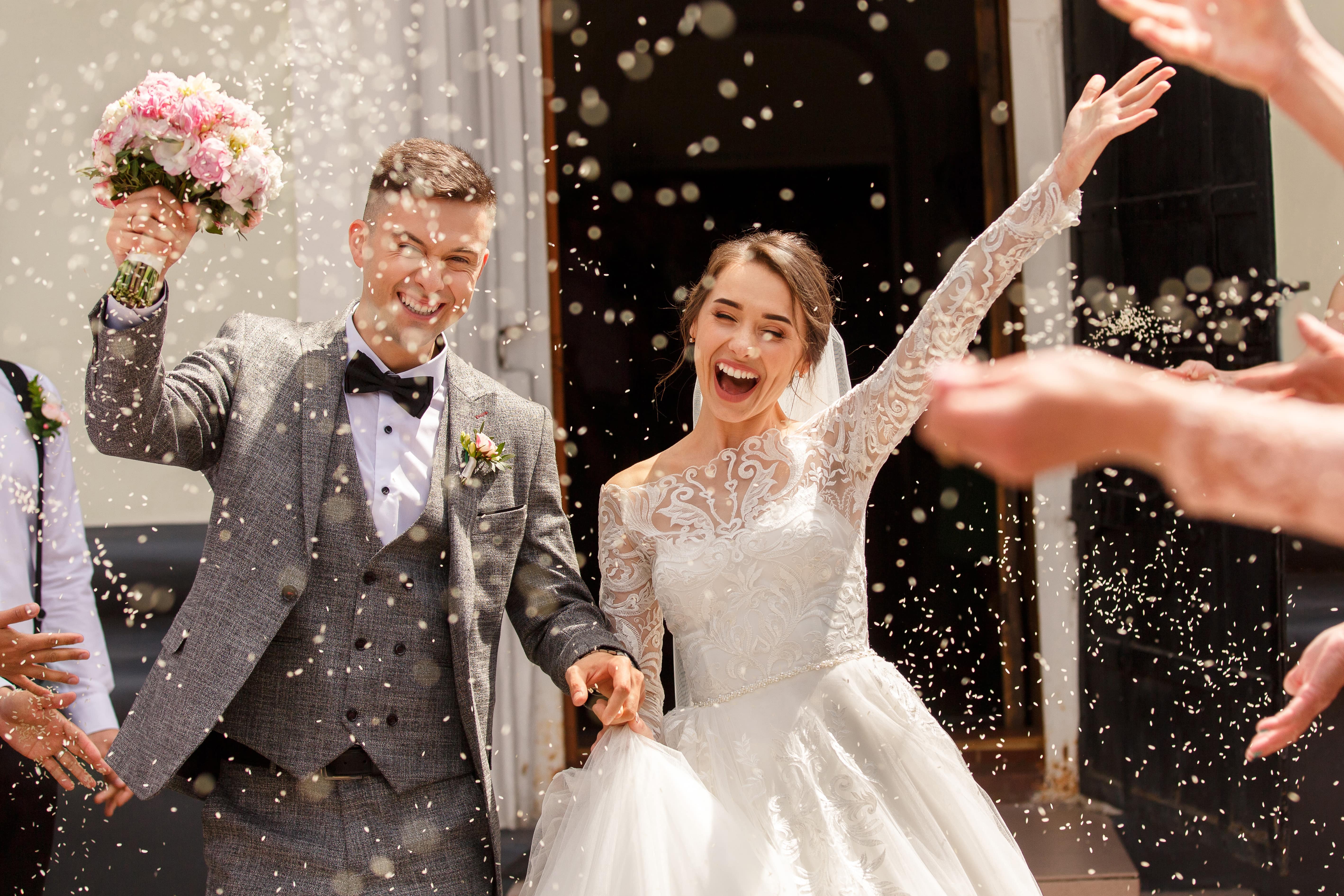 After creating a Club Savings Account to pay for their wedding, a young couple celebrates on their big day.
